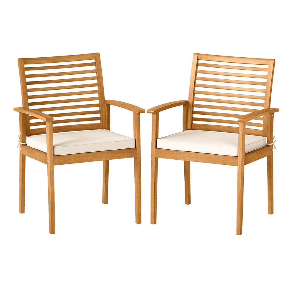 Set of 2 outdoor patio dining chairs in acacia wood with removable beige cushions and slatted backrest for comfort.