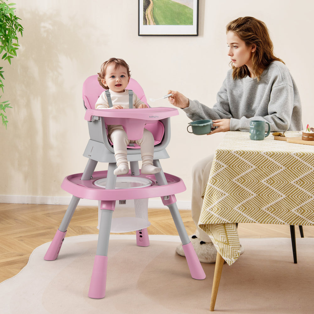Baby high chair in pink with adjustable height, activity center, and 5-point harness for safe feeding and playtime.