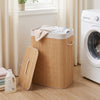 Bamboo clothes hamper with removable liner and portable handles, featuring a natural texture, perfect for laundry.
