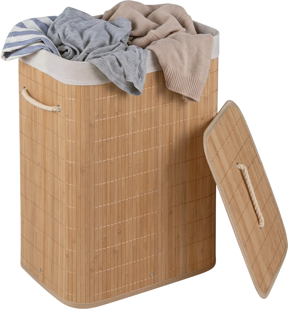 Bamboo clothes hamper with removable liner, portable handles, and top lid for concealed laundry storage.