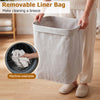 Bamboo clothes hamper with removable liner, 19-gal capacity, portable handles, ideal for laundry room organization.