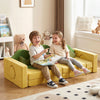Kids enjoying a cozy moment on the modular play couch in vibrant yellow and green, fostering creativity and bonding.