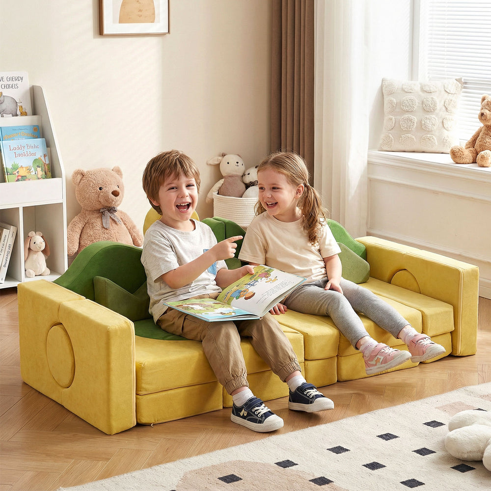 Kids enjoying a cozy moment on the modular play couch in vibrant yellow and green, fostering creativity and bonding.