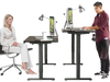 Electric height adjustable standing desk in black with memory controller, shown in both sitting and standing positions.