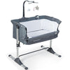 Height adjustable dark gray baby side crib with toy rack, music box, and mesh for easy nighttime monitoring.
