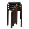 Single stackable bentwood round stool with padded black seat, featuring sturdy birch legs and non-slip foot pads for.
