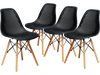 Set of four black modern plastic hollow chairs with beech wood legs, perfect for dining rooms or office spaces.