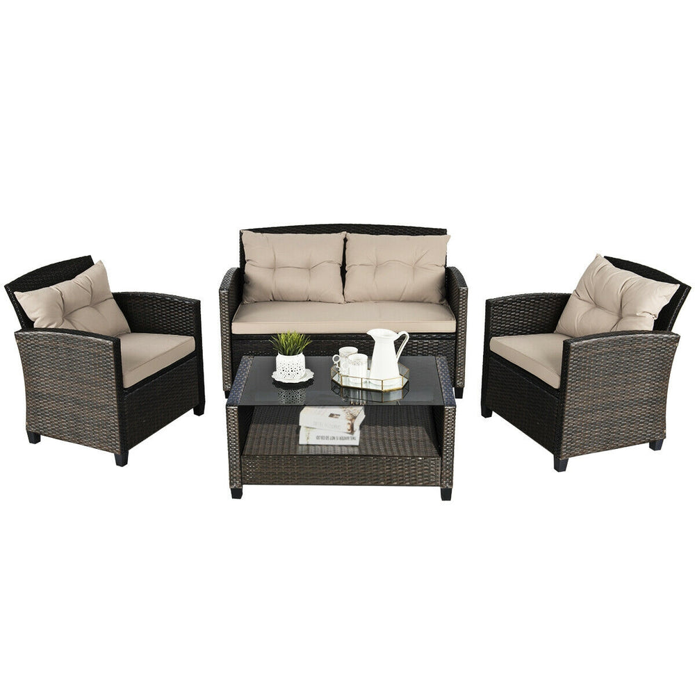4-piece outdoor rattan furniture set featuring 2 single sofas, a loveseat, and a glass-top tea table for backyard.