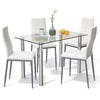 Dining set featuring a clear glass table and four white PVC leather chairs, perfect for modern dining rooms.