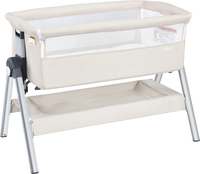 Portable baby bedside sleeper in beige with adjustable height and angle, featuring a sturdy aluminum frame and cotton.