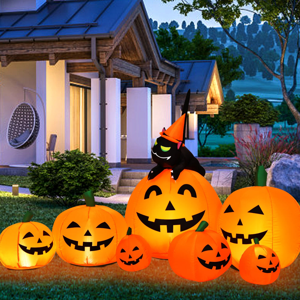 Inflatable Halloween pumpkin combo with a witch black cat, featuring orange LED lights for outdoor decoration.