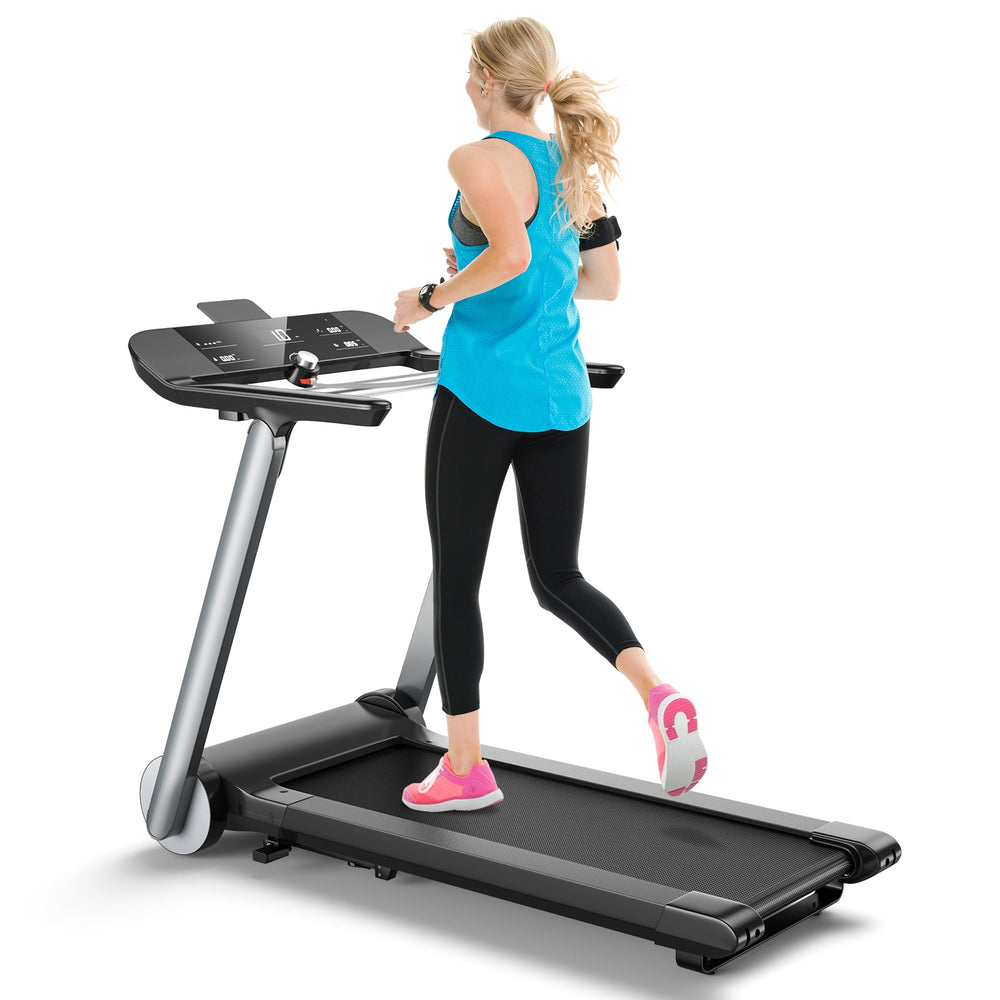 Folding treadmill with LED display and heart rate monitor, ideal for home workouts and easy storage.