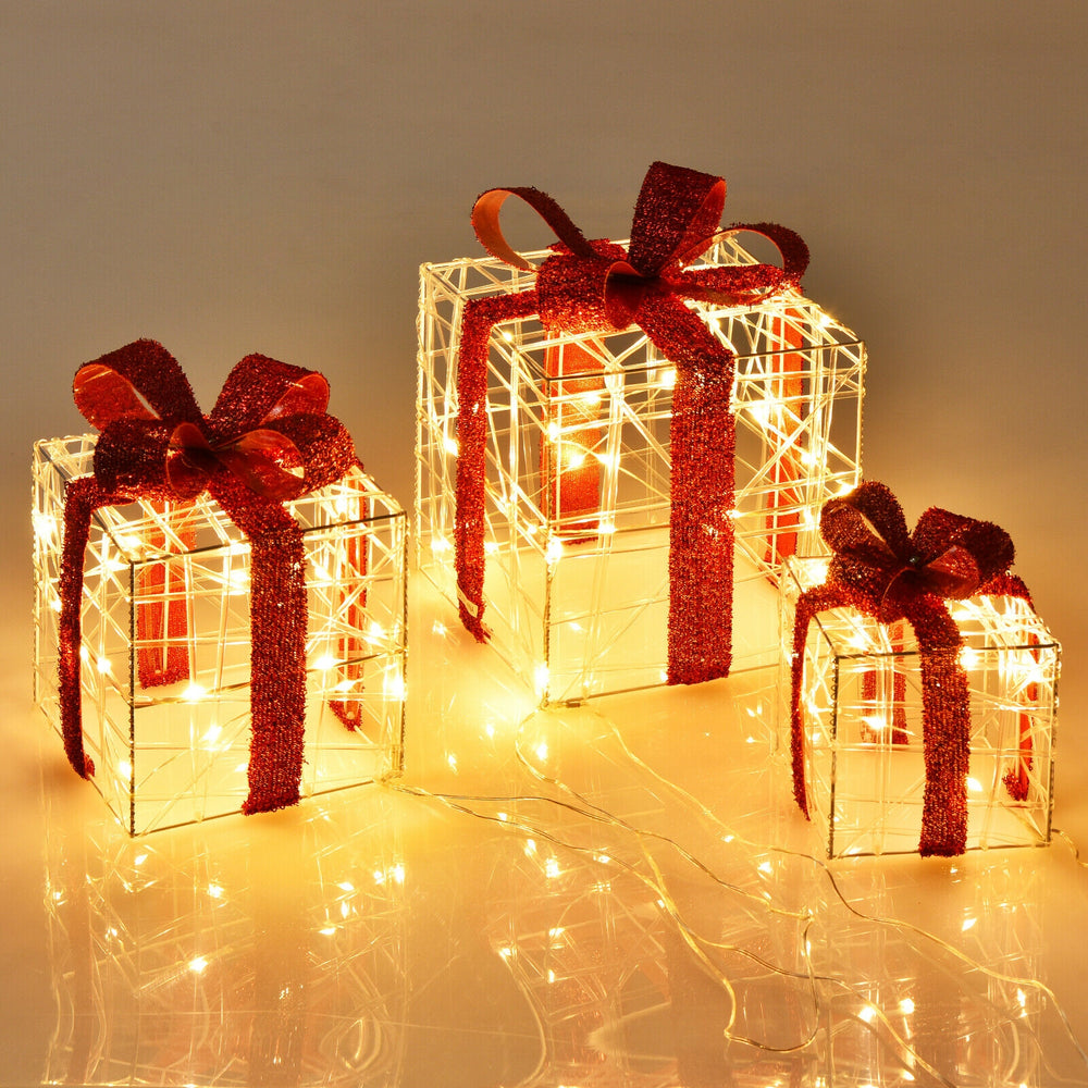 Three lighted gift box decorations with red ribbons, featuring 60 LED lights for festive indoor and outdoor displays.