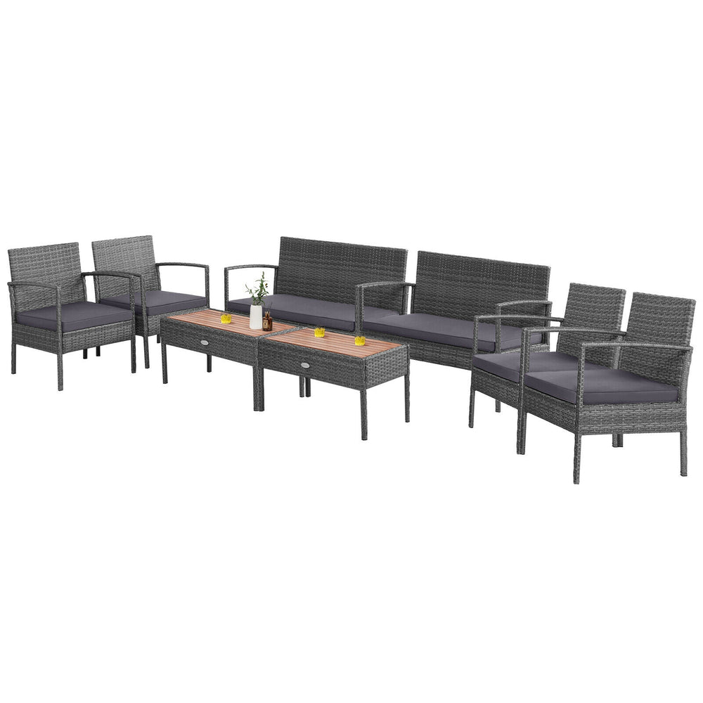 4-piece rattan patio conversation set with acacia wood tabletop, featuring 2 single sofas, a loveseat, and a coffee.