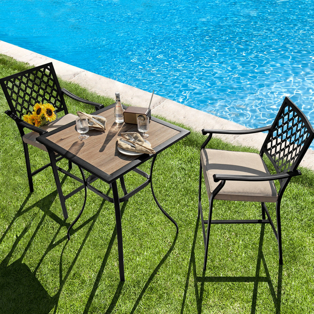 Two patio bar stools with cushions and armrests, perfect for poolside relaxation and backyard gatherings.
