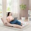 Adjustable beige sleeper lounge couch with two pillows, perfect for relaxing or working comfortably at home.