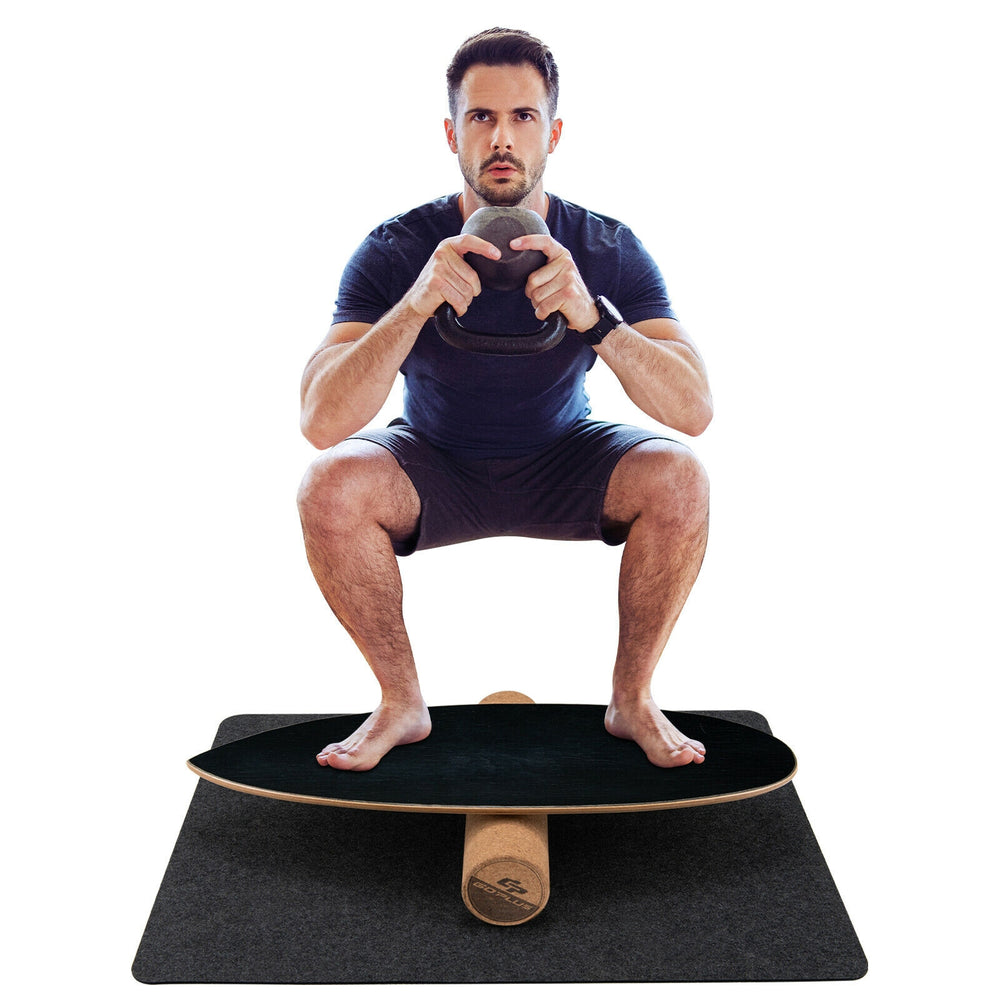 Balance board trainer in black for core strength, featuring birch and cork wood, ideal for home and gym workouts.