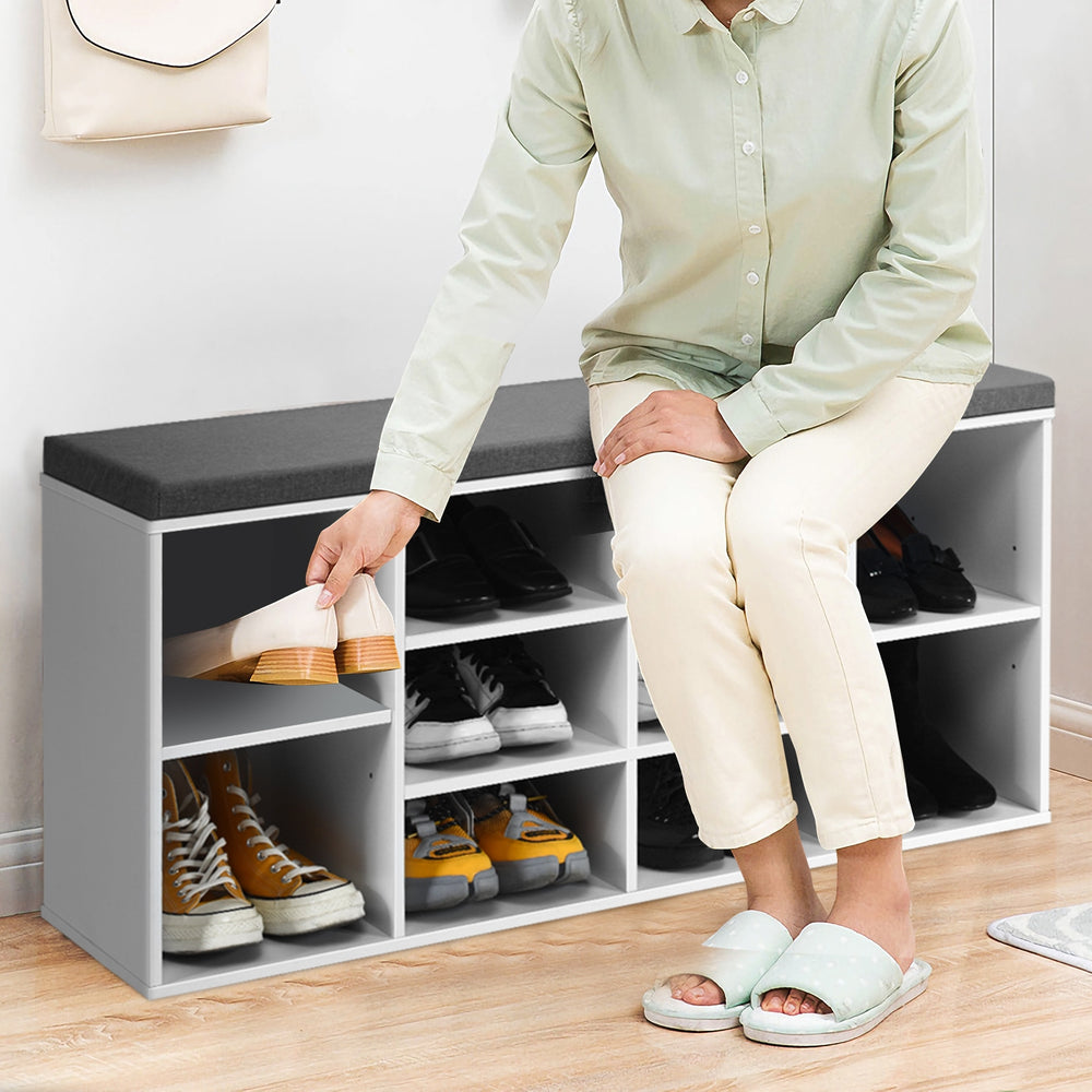 Shoe storage bench with cushion, featuring 10 cubes for organization, made of durable chipboard, ideal for entryway use.