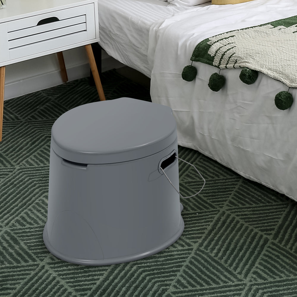Compact 5L portable travel toilet in gray, designed for outdoor use with removable inner bucket and paper holder.