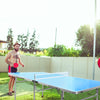 Portable 60-inch blue ping pong table with paddles and balls, perfect for outdoor fun and easy storage.