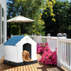 Plastic waterproof ventilated pet house with a blue roof, providing a cozy outdoor shelter for dogs on a deck.