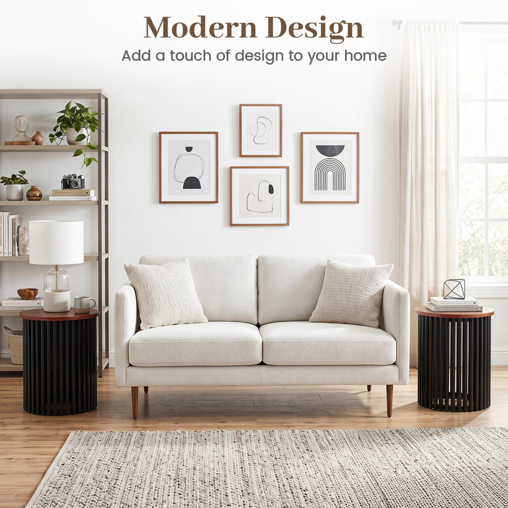 Elegant round coffee table made of solid acacia wood, featuring a modern design for living room or home office use.