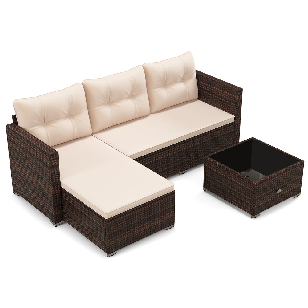 Outdoor wicker furniture set featuring a beige sectional sofa and tempered glass coffee table, perfect for backyard.