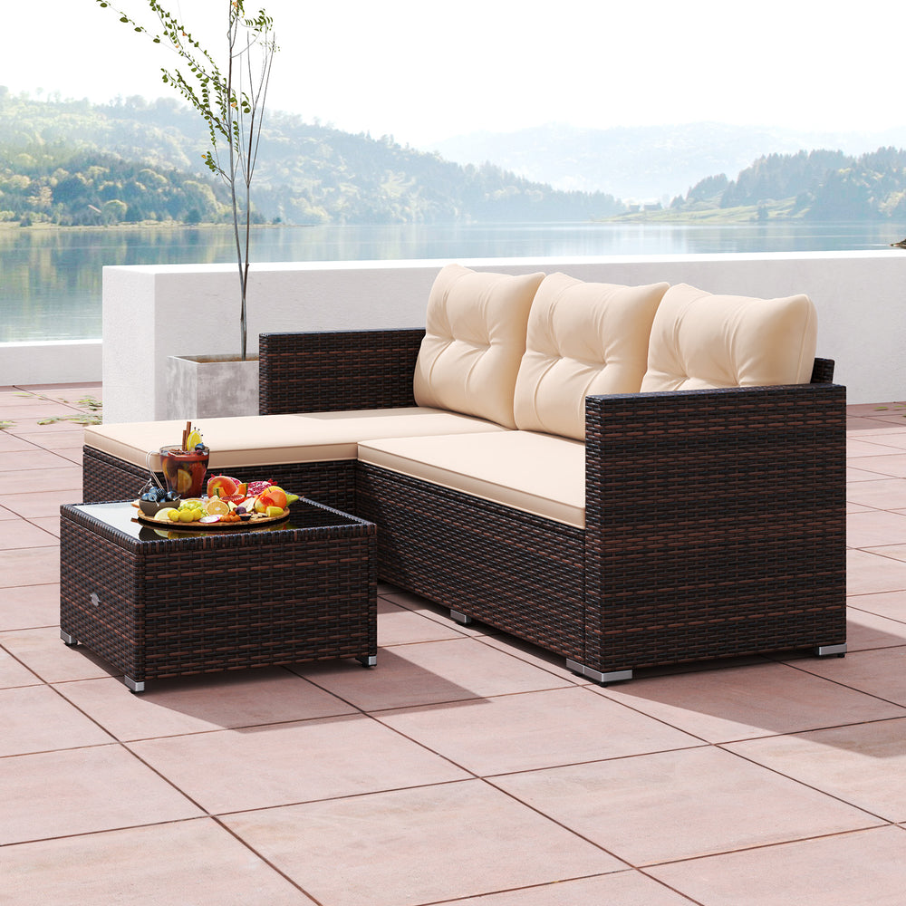 Outdoor wicker furniture set featuring a beige cushioned sectional and tempered glass coffee table, perfect for.