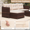 Outdoor wicker furniture set featuring soft beige cushions and a tempered glass coffee table, perfect for backyard.