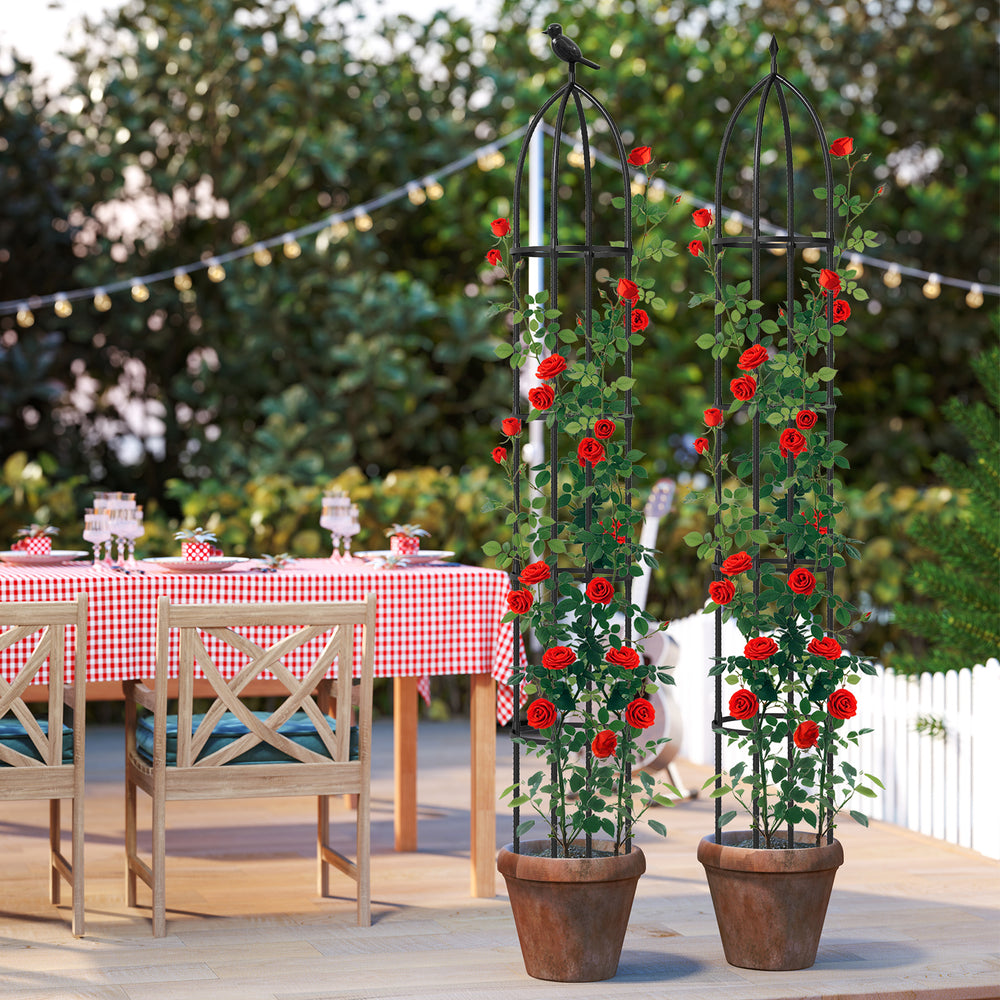 Two black garden obelisk trellises with climbing red roses, perfect for supporting various plants in your garden.