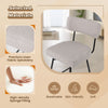 Close-up of the beige upholstered seat of a 25-inch bar stool with breathable fabric and ergonomic backrest for comfort.