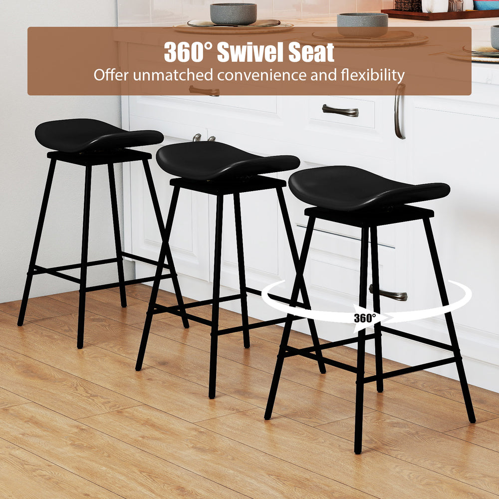 Close-up of a black swivel barstool's saddle seat, featuring faux leather upholstery and ergonomic design for comfort.