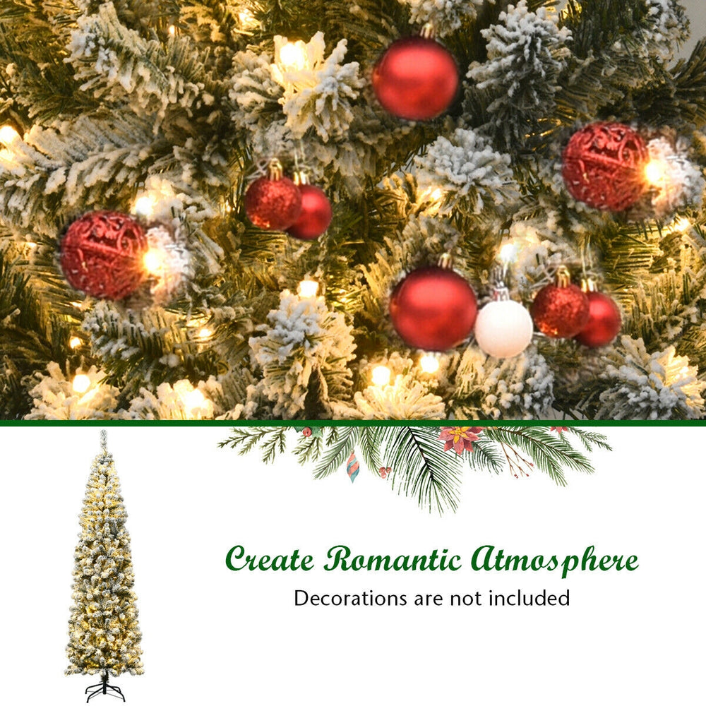 Snow flocked branches of a 7.5 feet pre-lit pencil Christmas tree with 350 warm LED lights for festive decor.
