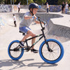 20" trick bicycle with navy frame, 360° steering, and adjustable seat, perfect for kids and teens at the skatepark.