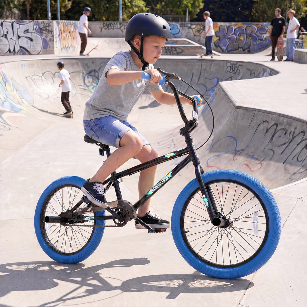 20" trick bicycle with navy frame, 360° steering, and adjustable seat, perfect for kids and teens at the skatepark.