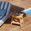 Teak wood shower bench with storage shelf, slatted design, and adjustable foot pads for stability by the poolside.