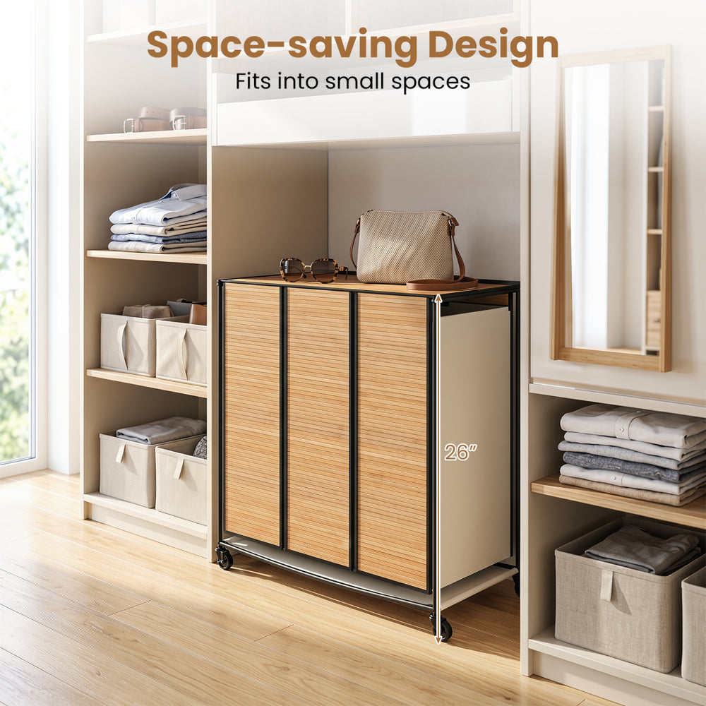 Three-section laundry hamper with lid, natural bamboo slats, and lockable wheels for easy mobility in small spaces.
