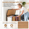Three-section laundry hamper with lid made of natural bamboo slats, featuring lockable wheels for easy mobility.
