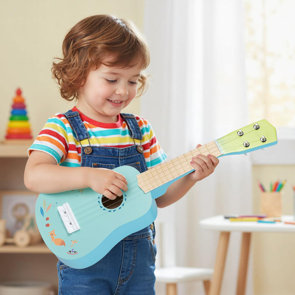 Child playing a 21-inch ukulele guitar with a basswood body, designed for kids aged 3 and up, promoting music learning.