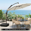 Cantilever patio umbrella base with wheels, holding up to 225 lbs, ideal for stability and easy mobility on outdoor.