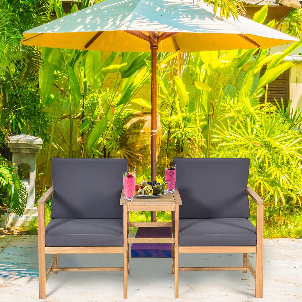 Two-seater acacia wood loveseat with thick cushions and separable coffee table, perfect for outdoor relaxation.