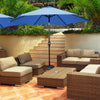 Blue 9-foot solar LED lighted patio umbrella with tilt adjustment, placed over a rattan seating area for outdoor.
