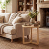 Rustic 22.5" round side table showcasing a natural wood finish, ideal as a versatile accent table in any cozy setting.