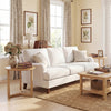 Natural-finish round side table with a triangular design and rubber wood legs, ideal for bedside or living room use.