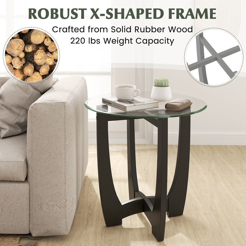 Round end side table with tempered glass top, robust rubber wood frame, and X-shaped design for stability and elegance.
