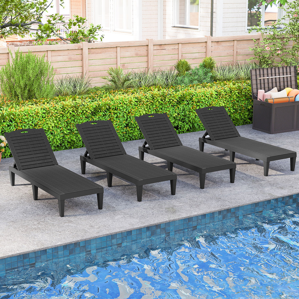 Set of two black outdoor PP chaise lounge chairs with adjustable backrests, perfect for poolside relaxation.