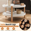 Round 23.5" coffee table with solid beech legs, featuring a white finish and open storage shelf for easy access.
