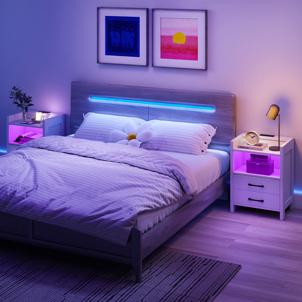 Nightstand with charging station and LED lighting, featuring open storage and two drawers for organized space.