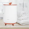 Large luxury towel warmer with a tree branch handle, 23L capacity, and removable lid for convenient use.