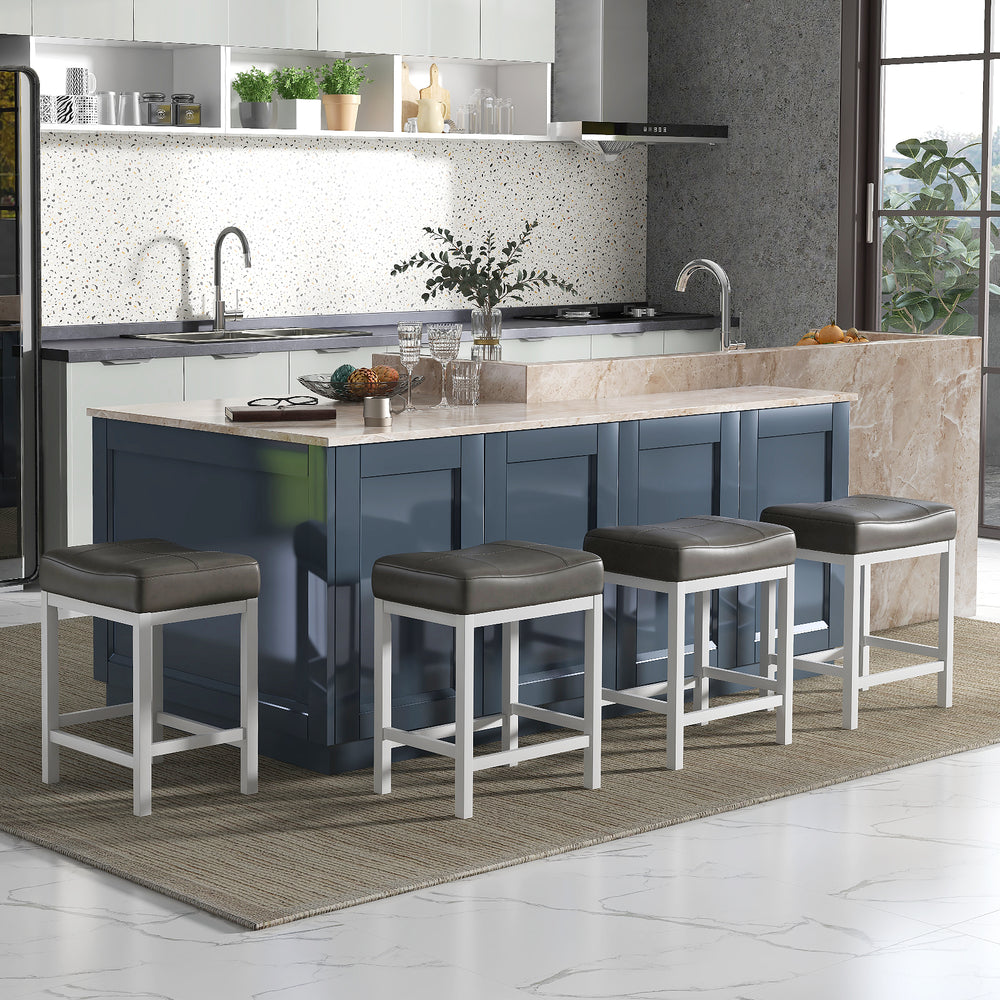 Set of two 24.5-inch black and white linen fabric saddle stools with cushioned seats for counter height tables.